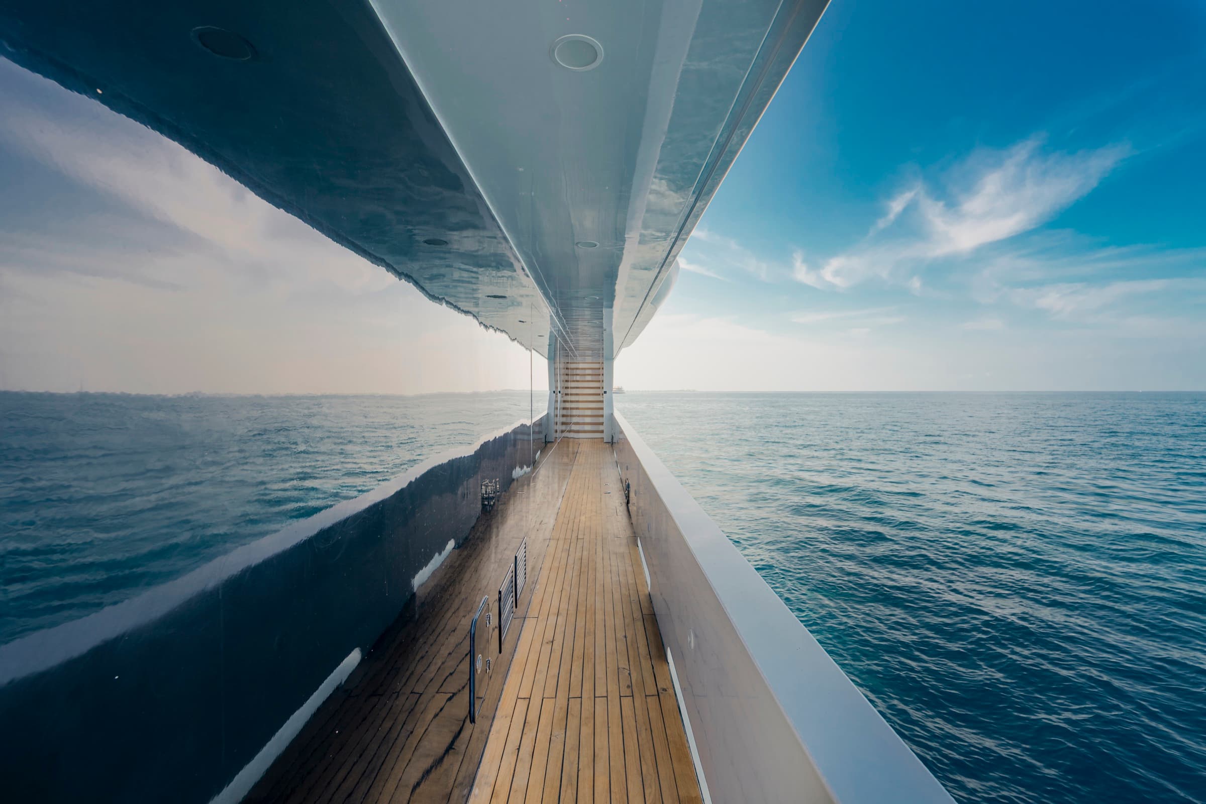 SERAI Ocean Dream luxury yacht — starboard walkway with teak decking and ocean horizon