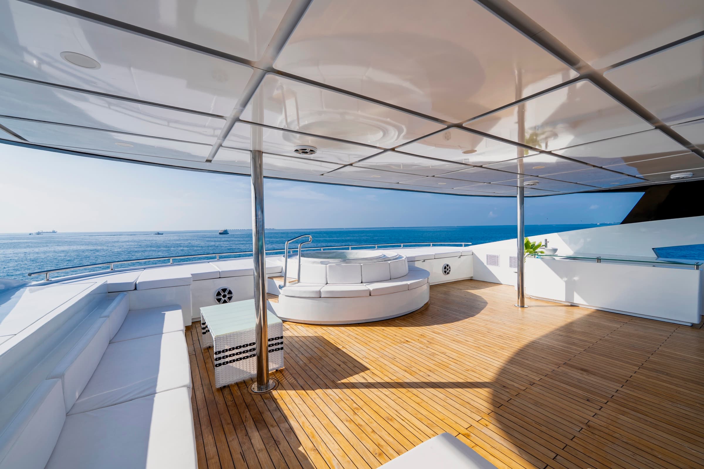 Spacious sun deck with loungers aboard SERAI